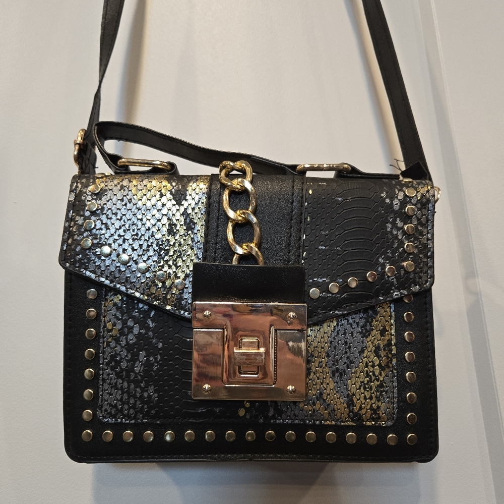 Black, gold, silver handbag -- two handles
